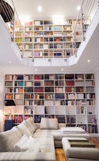 white wooden book shelves with books