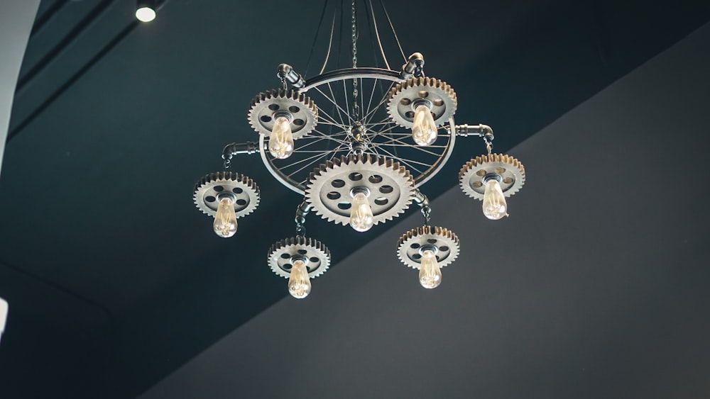 gold and white chandelier turned on during daytime
