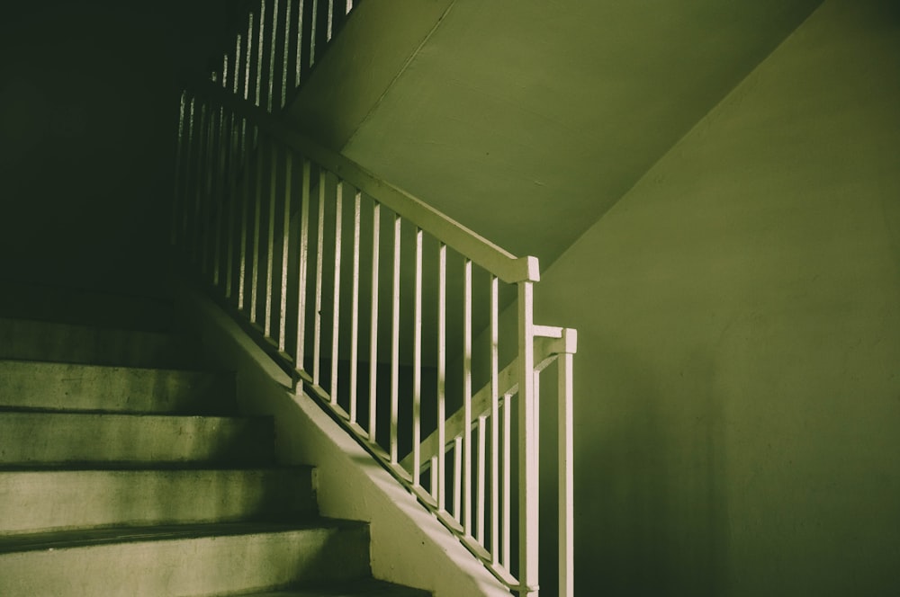 white wooden staircase with white railings