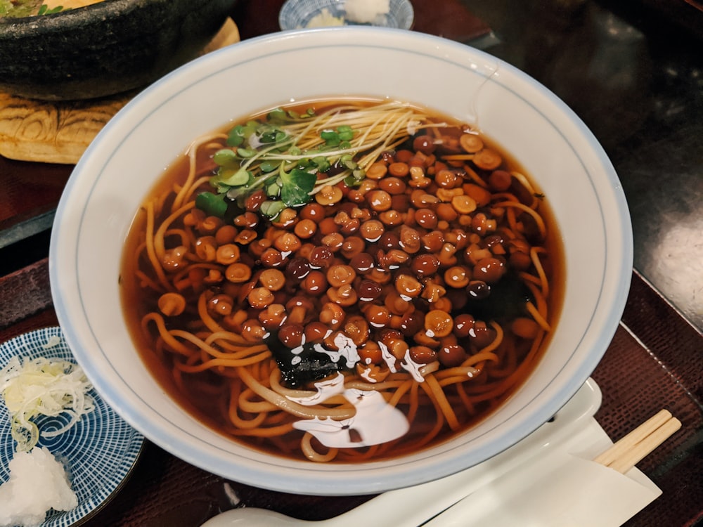 white ceramic bowl with brown soup