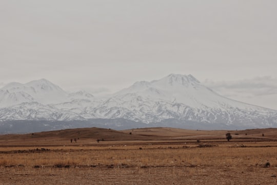 snow covered mountain during daytime in Cappadocia Turkey