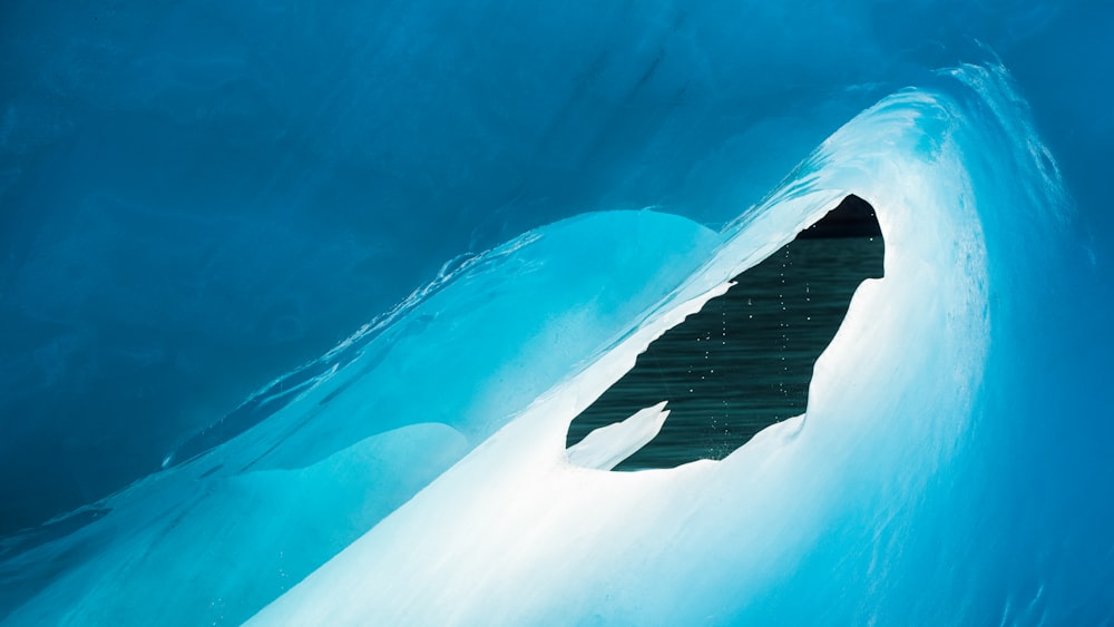 white and blue ice in water