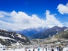 people on snow covered mountain during daytime