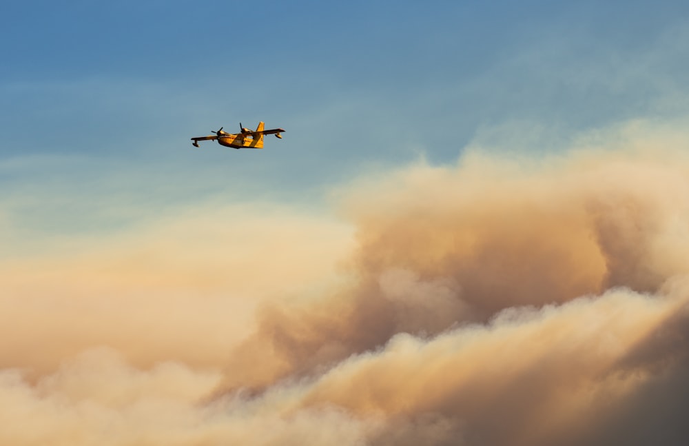 brown and black helicopter flying in the sky