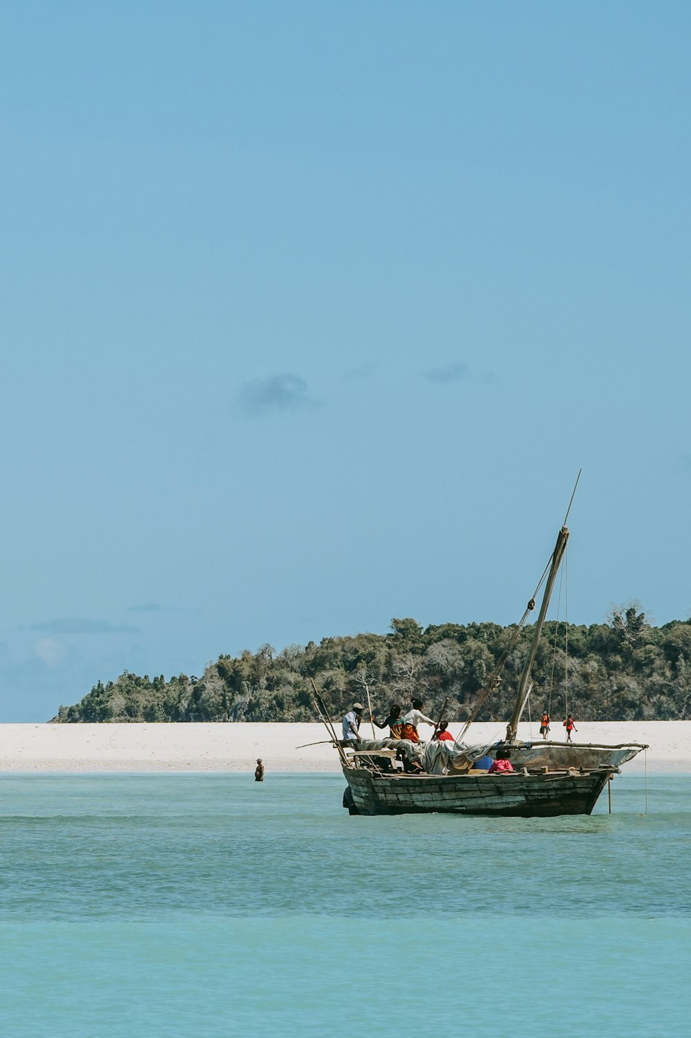 people riding boat on sea during daytime