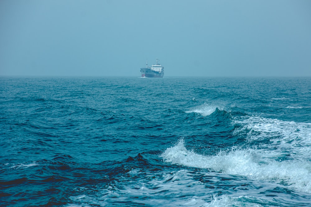 white ship on sea during daytime