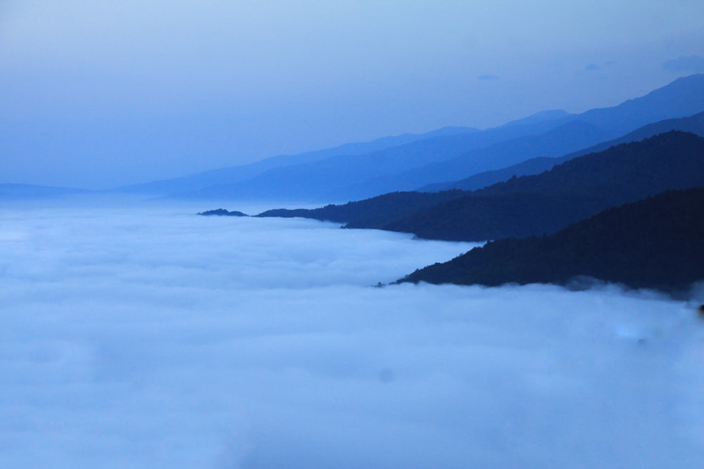 mountains covered with white clouds