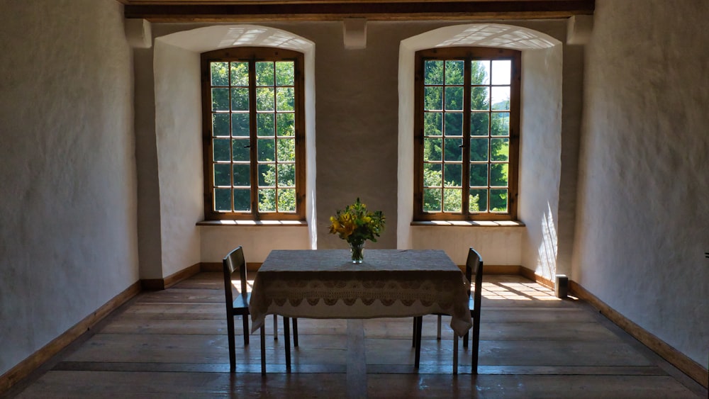 brown wooden table with chairs