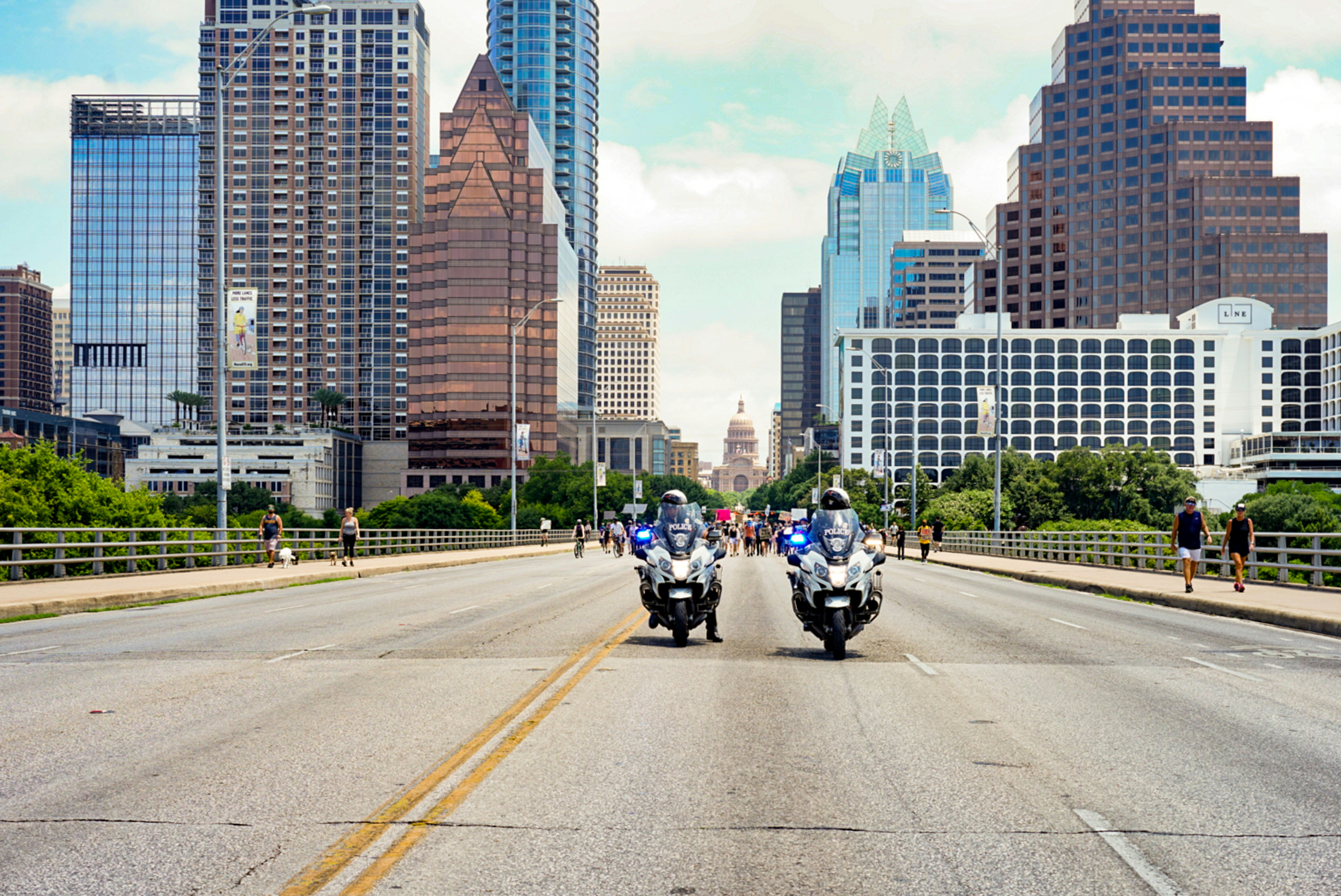people riding motorcycle on road during daytime