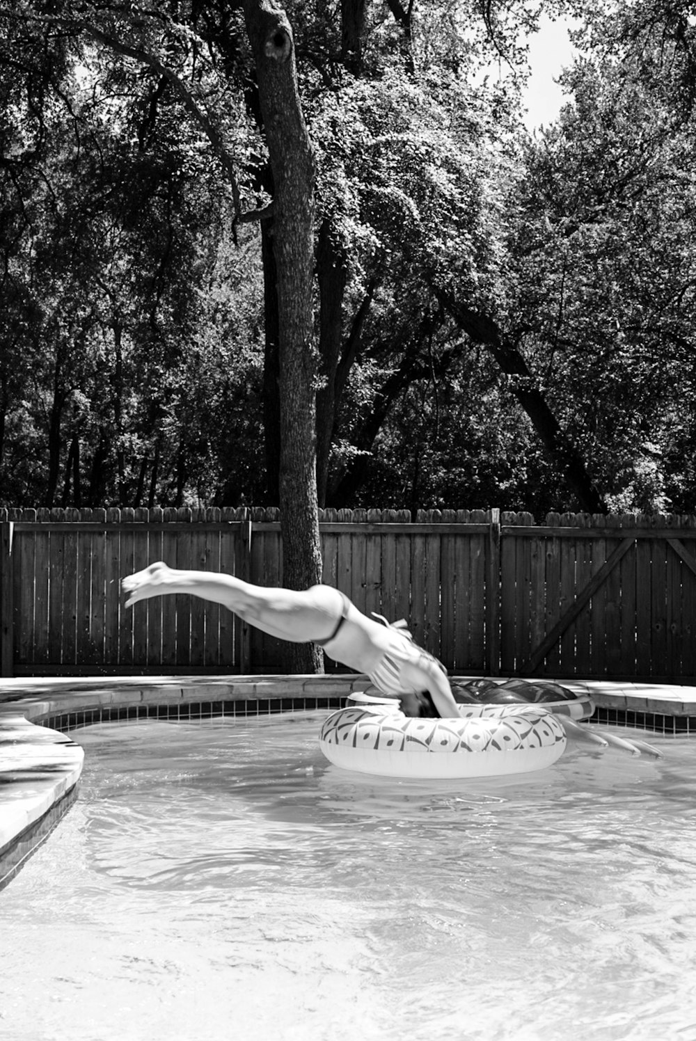 grayscale photo of woman in water