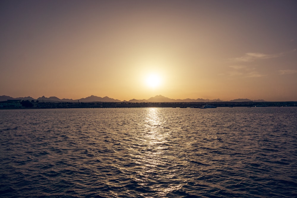 body of water during sunset