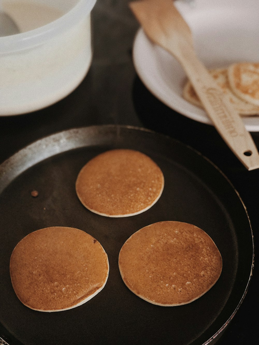 brown food on black frying pan