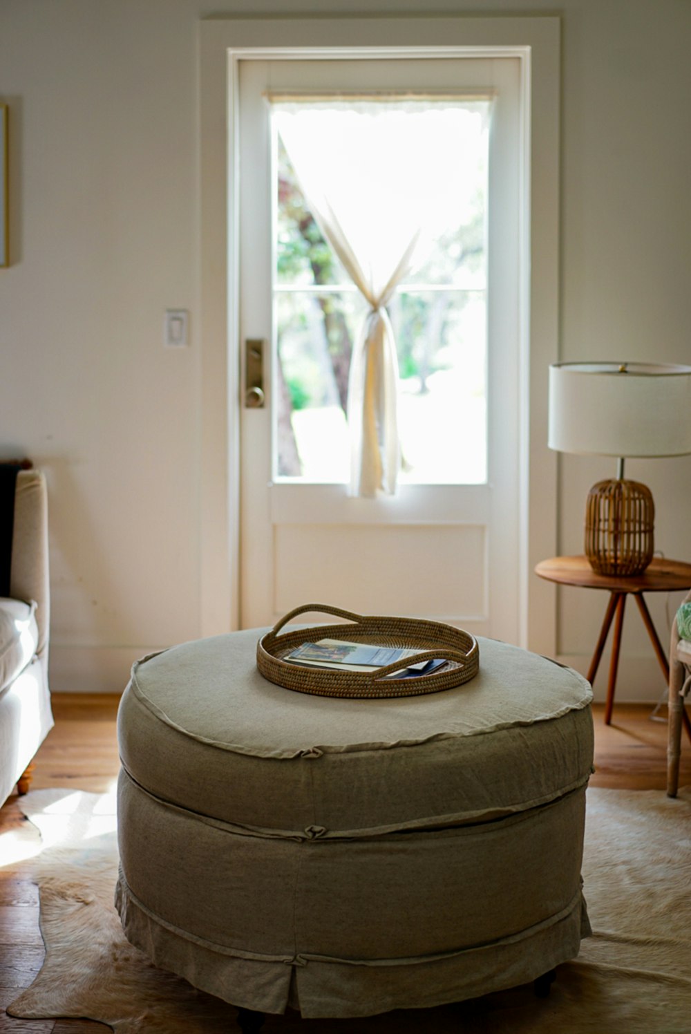 brown woven basket on gray ottoman