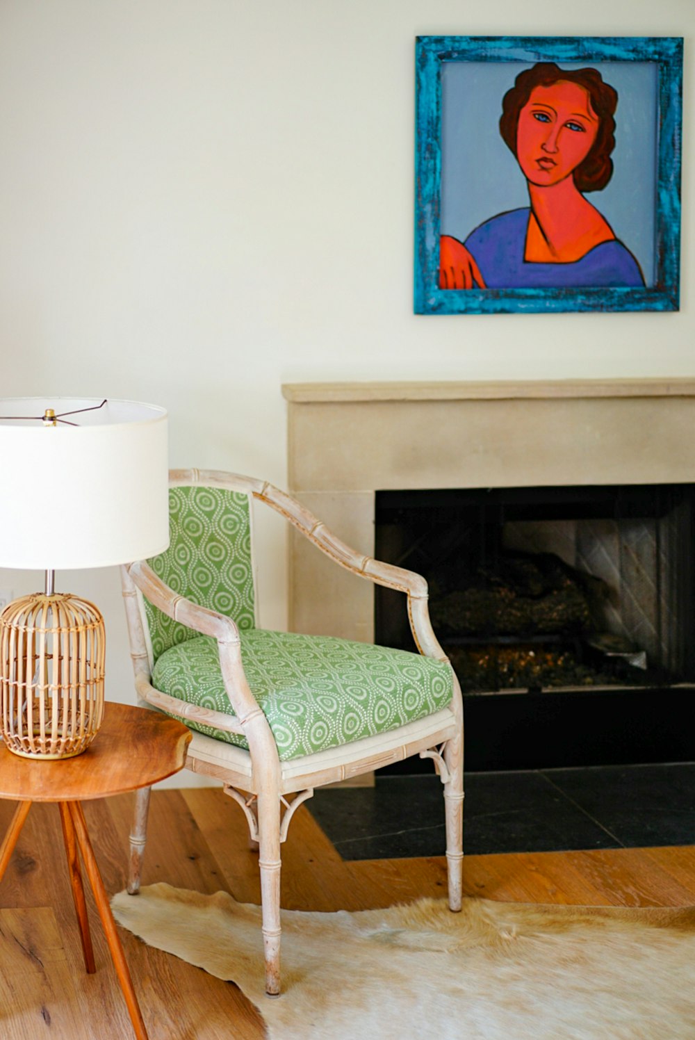 white and brown wooden armchair beside white table lamp