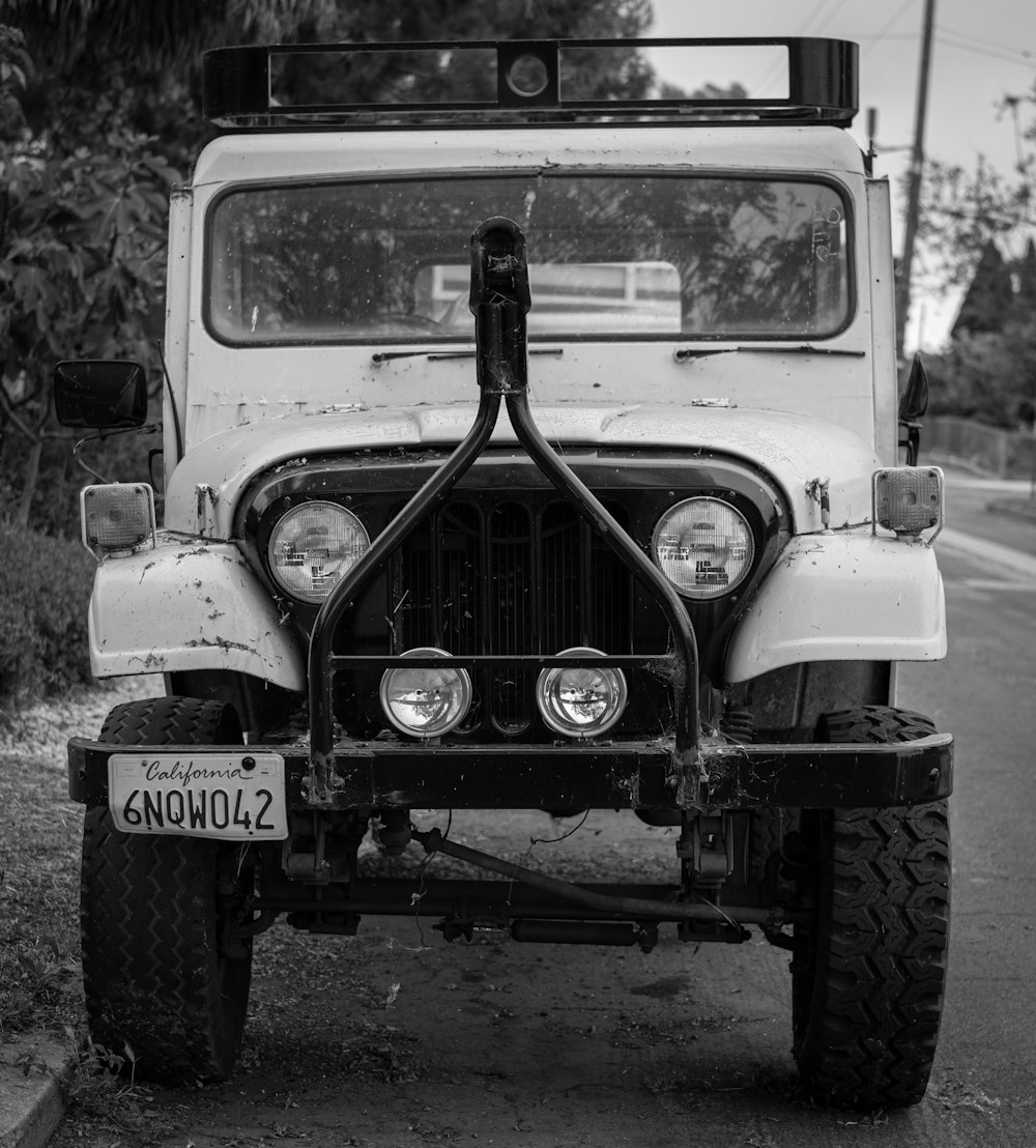 grayscale photo of vintage car