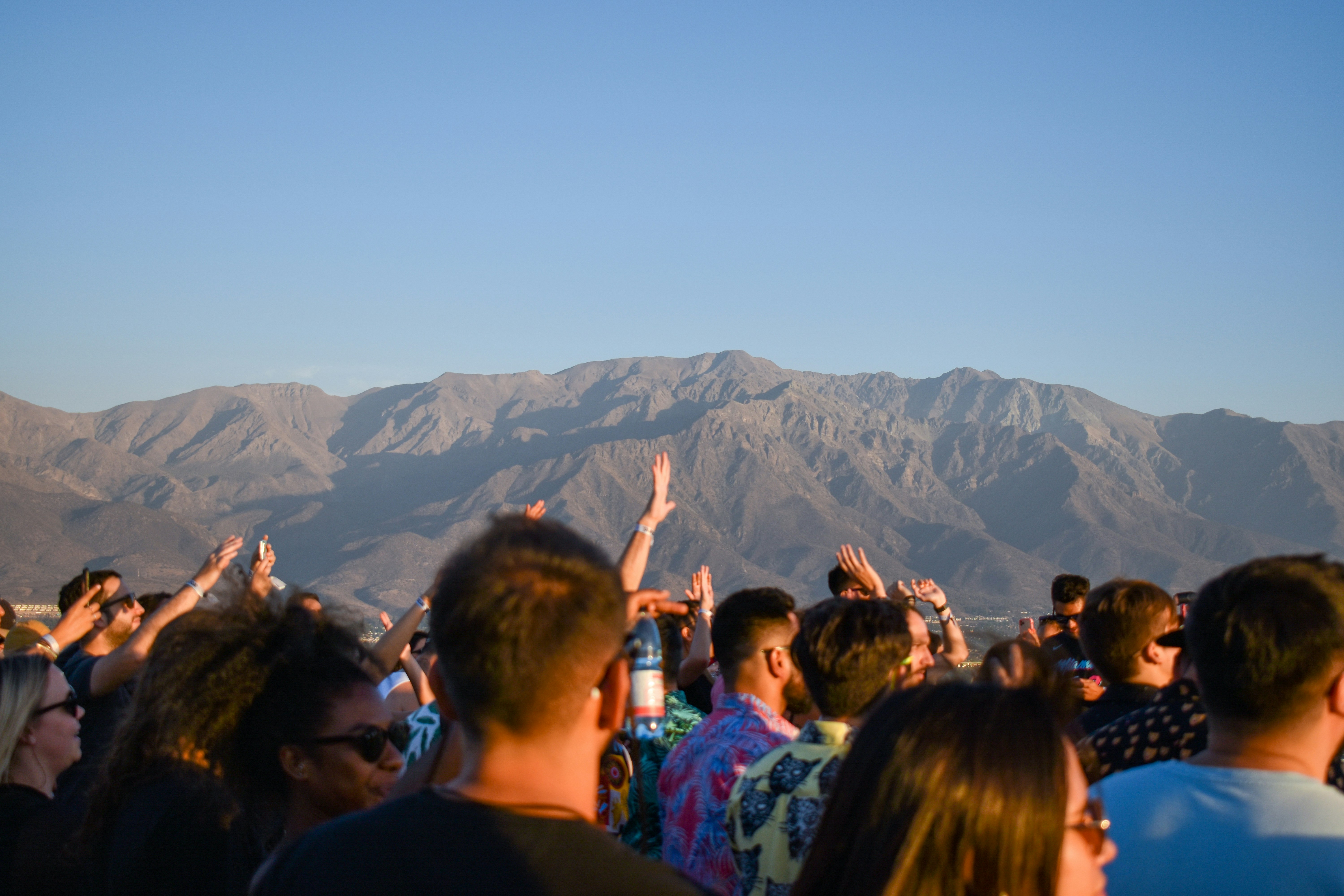 people standing on mountain during daytime
