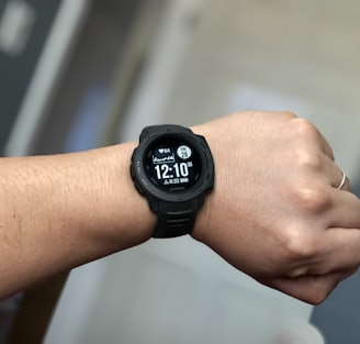 person wearing black digital watch
