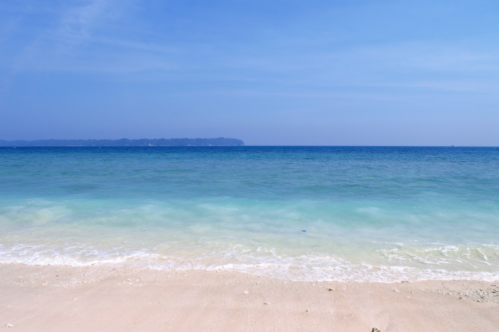 blue sea under blue sky during daytime