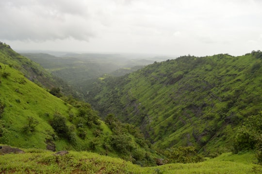 green mountains under white clouds during daytime in Igatpuri India