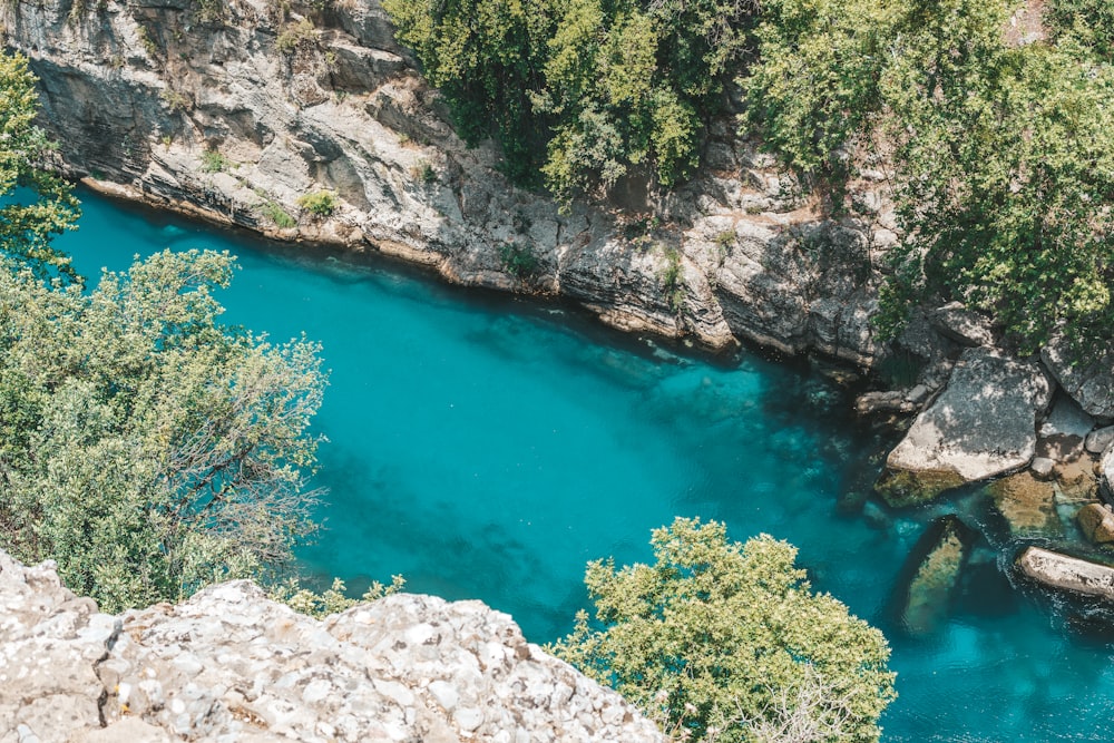 blue water in the middle of rocky mountains