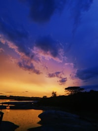 A vibrant sunset over a serene landscape, capturing the beauty of nature.