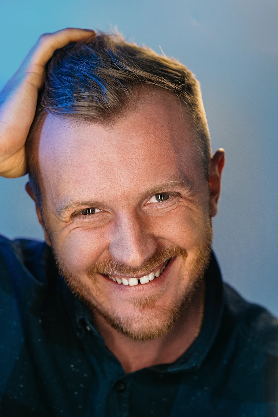Confident man with a healthy, full head of hair after treatment