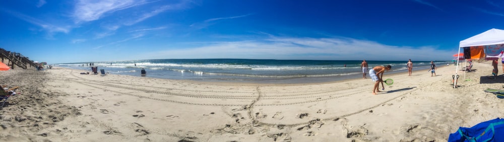 white sand beach under blue sky during daytime