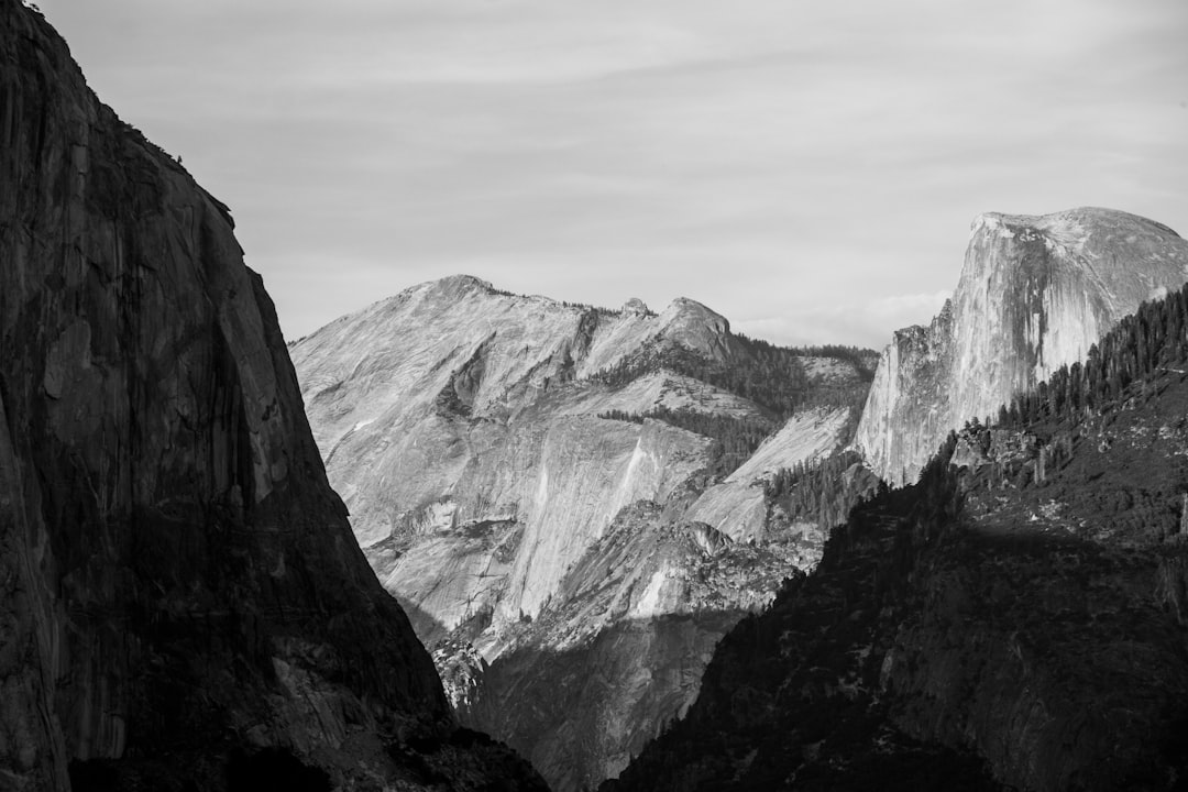 grayscale photo of rocky mountains