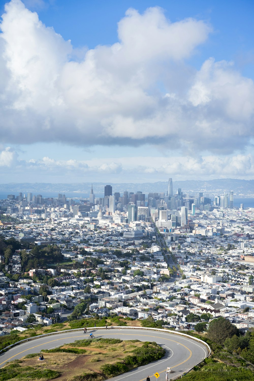 city skyline under white clouds during daytime