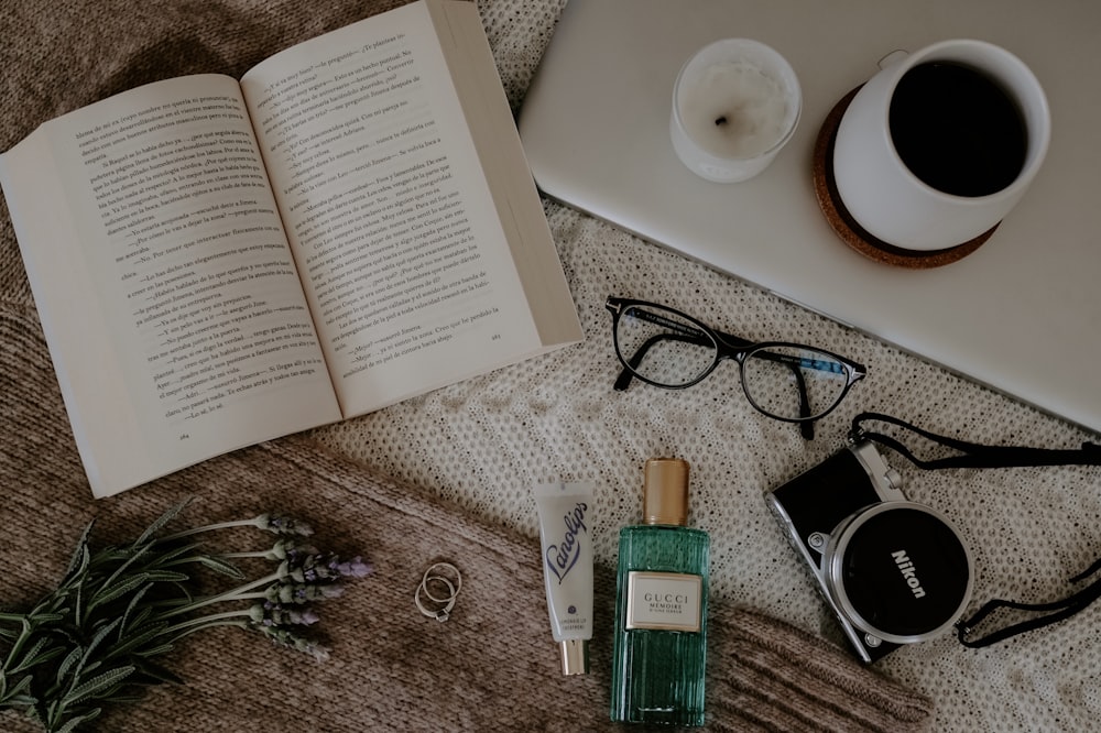 black and silver framed eyeglasses on book page