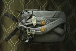 black leather handbag on black textile