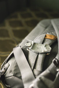 Close-up shot of a variety of durable backpacks and morrales in muted, natural tones.
