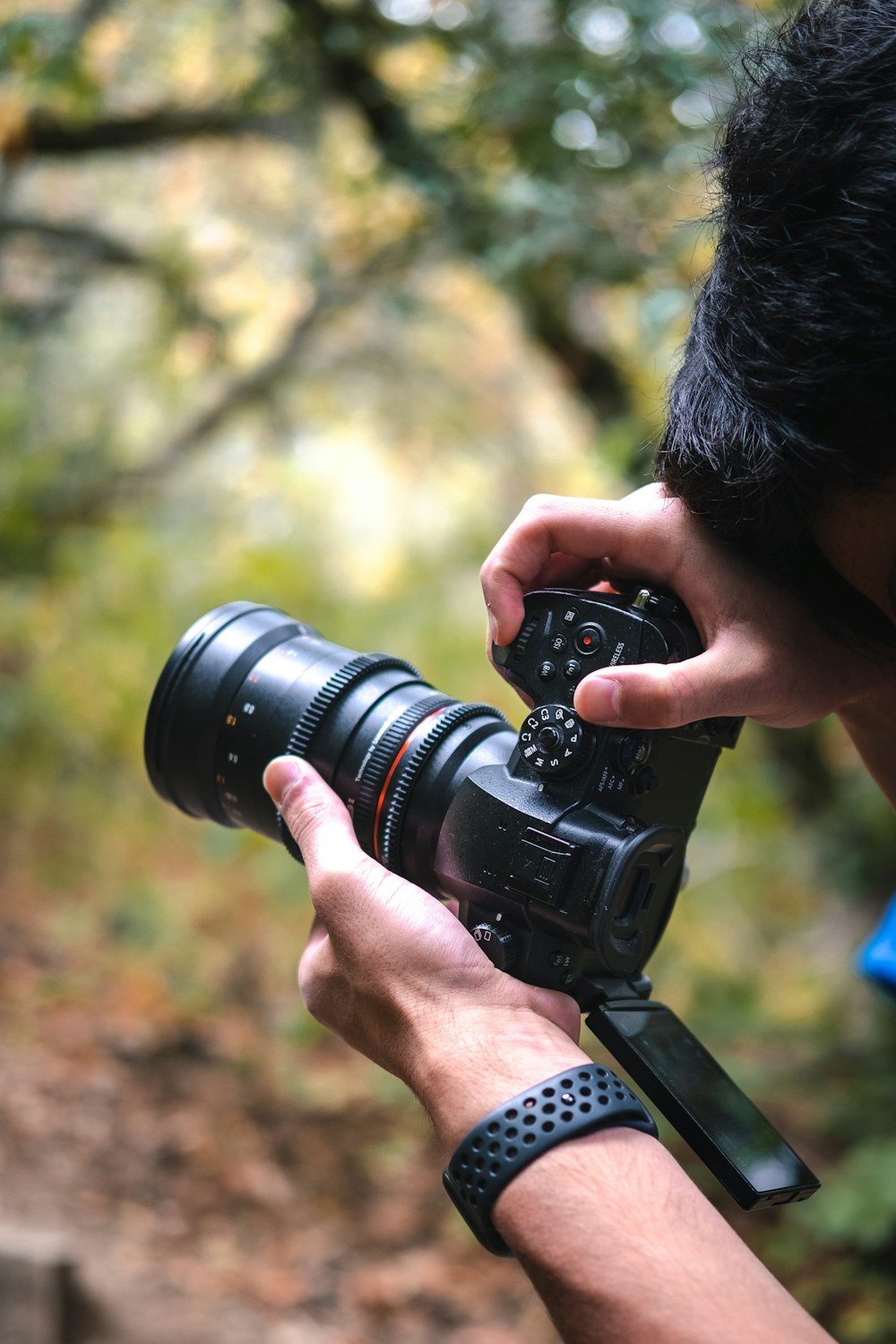 person holding black dslr camera