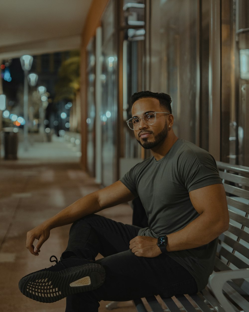 man in gray crew neck t-shirt sitting on black chair