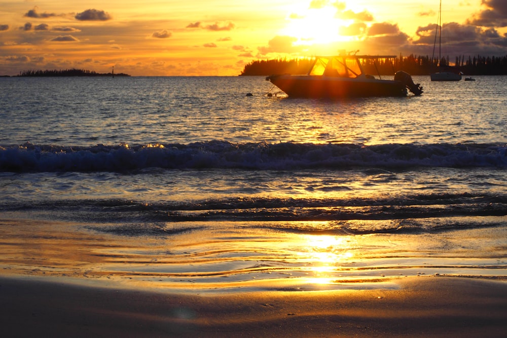 silhouette of people on beach during sunset