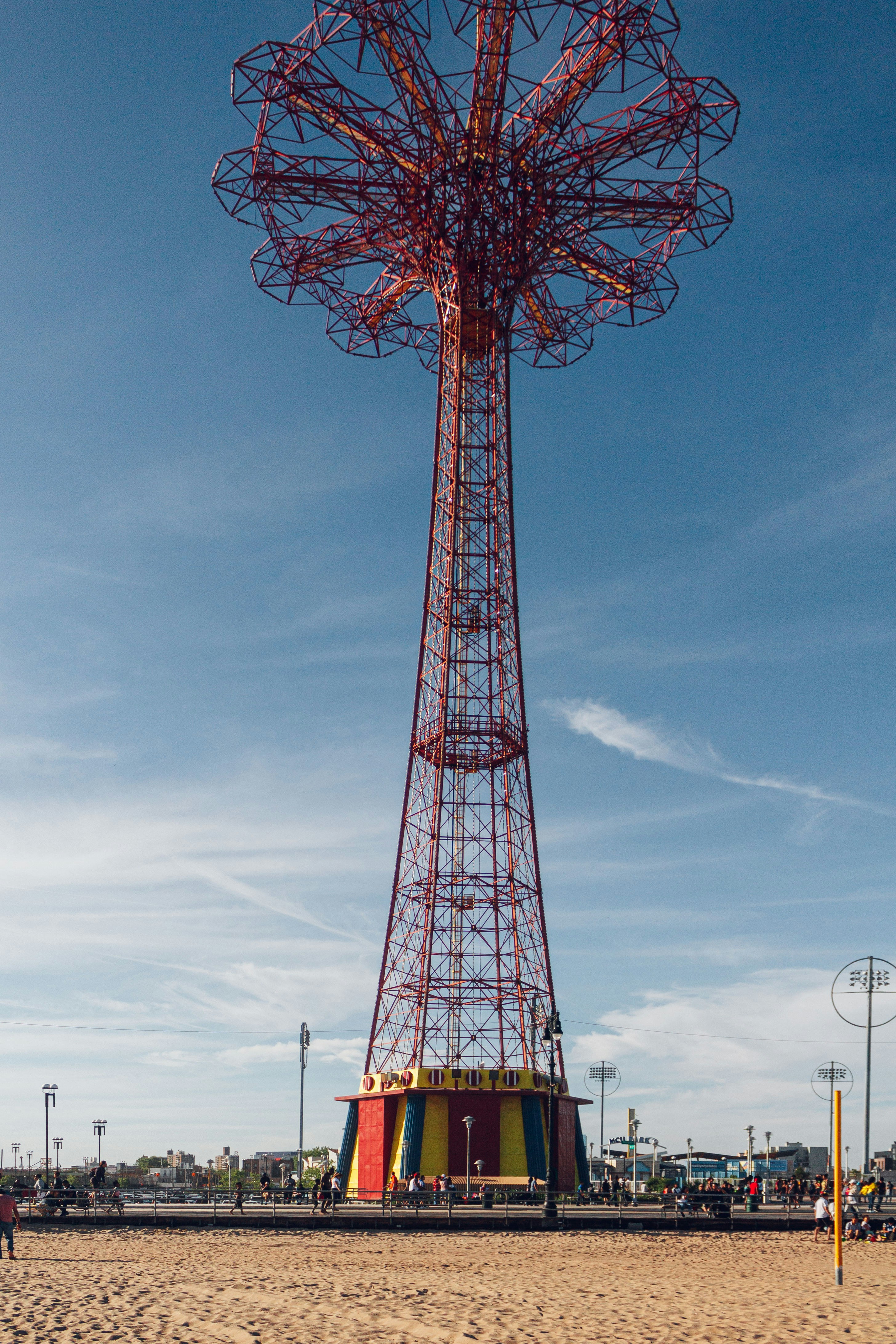 red and black ferris wheel under blue sky during daytime