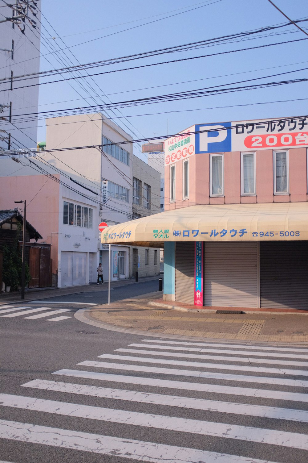 white and blue building beside road during daytime