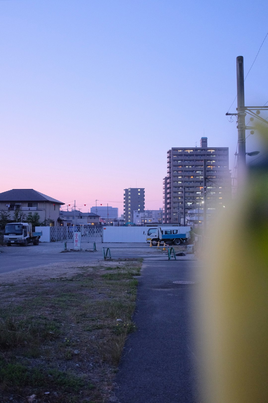 blue and white bus on road near buildings during daytime