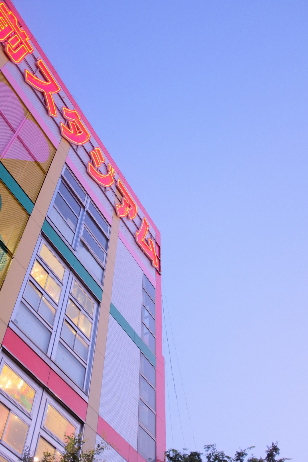 red and white concrete building under blue sky during daytime