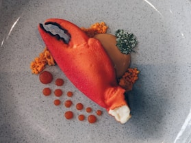 red and white carrot on white ceramic plate