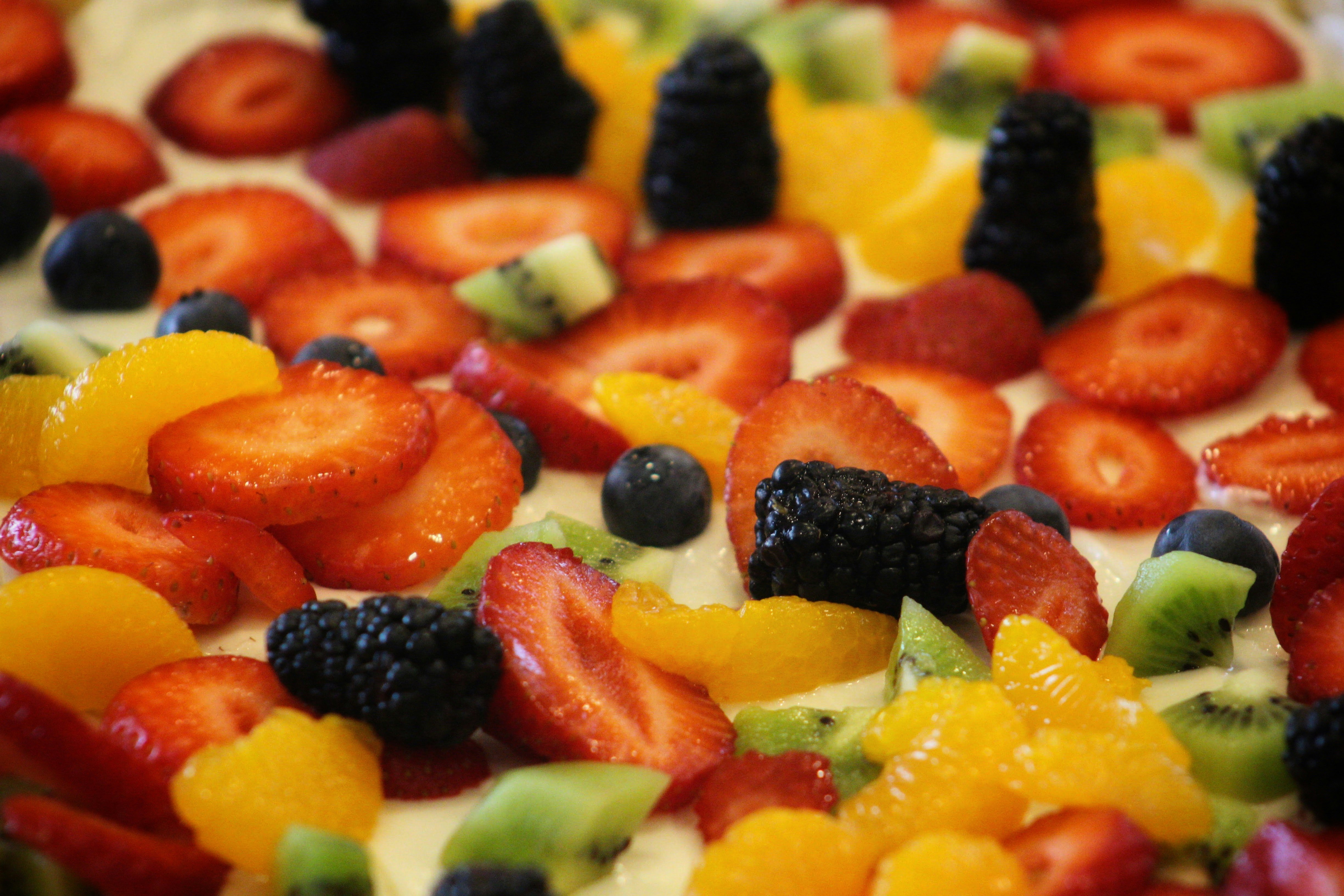 sliced fruits on white ceramic plate