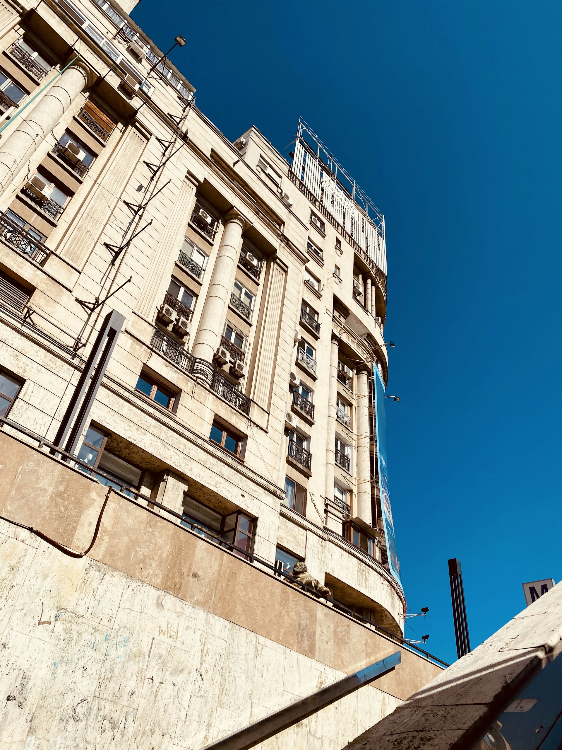 woman wearing yellow long-sleeved dress under white clouds and blue sky during daytime