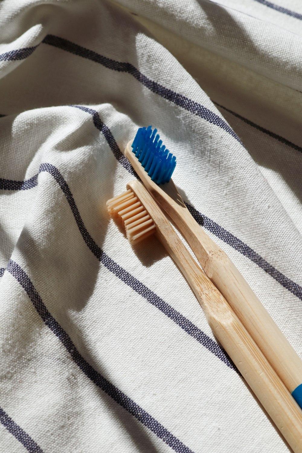 blue and brown wooden toothbrushes - how to get rid of ingrown hair on neck