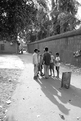 A group of children playing together in a sunny park.