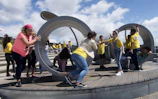 Children playing joyfully on a colorful kidplay structure outdoors