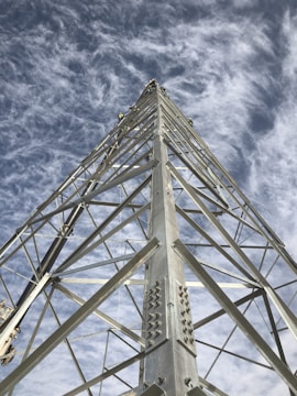 A team of workers installing a tower structure.