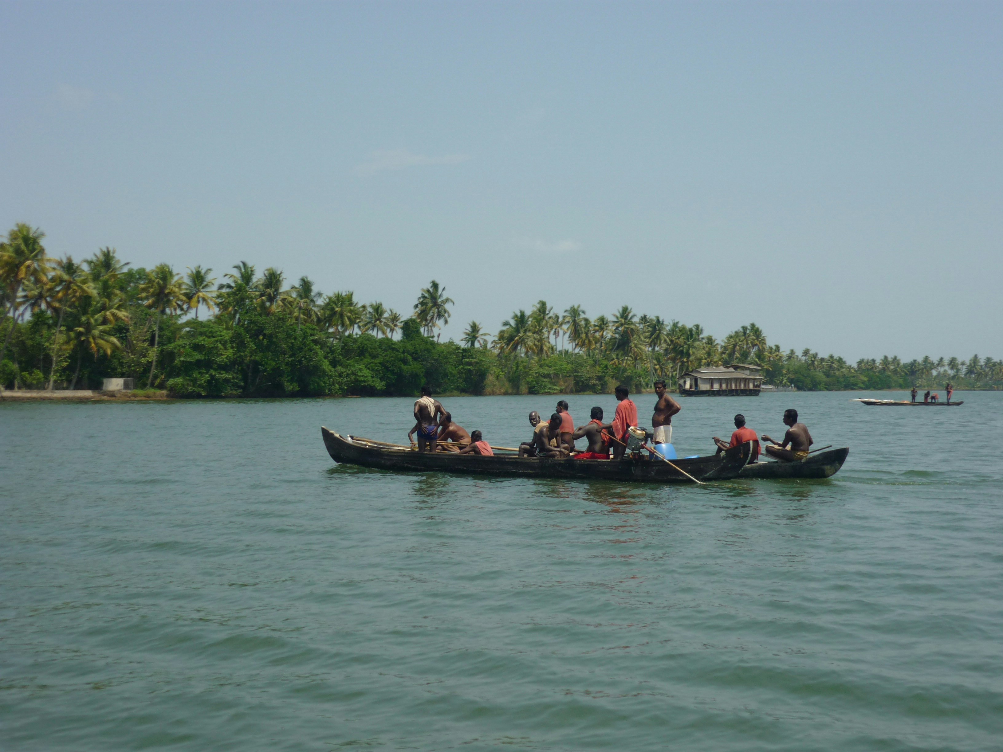 people riding on boat on body of water during daytime