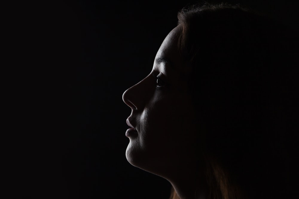 womans face with black background