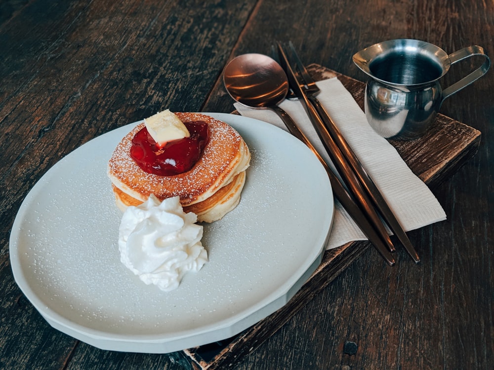 sliced strawberry cake on white ceramic plate