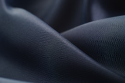 white textile in close up photography